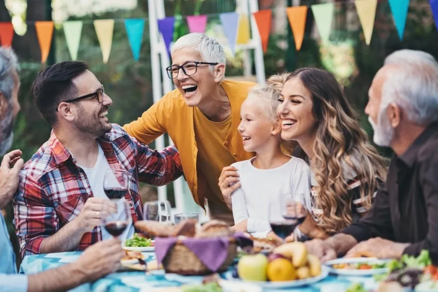 Happy family gathering outdoors with decorations